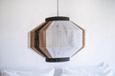 Handmade geometric pendant lamp made from sustainable paper threads in white, raw sienna, and black stripes - WADA NO.10 by Studio Ponce.