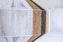 Handmade geometric pendant lamp made from sustainable paper threads in white, raw sienna, and black stripes - WADA NO.10 by Studio Ponce.