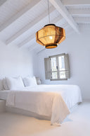 Handmade geometric pendant lamp made from sustainable paper threads in white, raw sienna, and black stripes - WADA NO.10 by Studio Ponce.